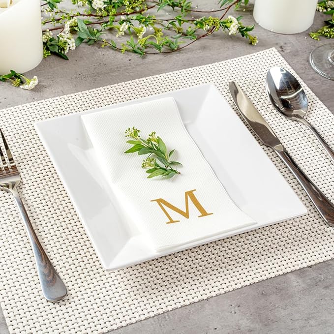 Restaurantware Napkins Pack of 300 Gold Letter M Linen-Feel Paper Disposable Guest Towels 15.75 x 7.87 Inches, Elegant Airlaid White Napkins For Birthdays, Weddings and Catering Events