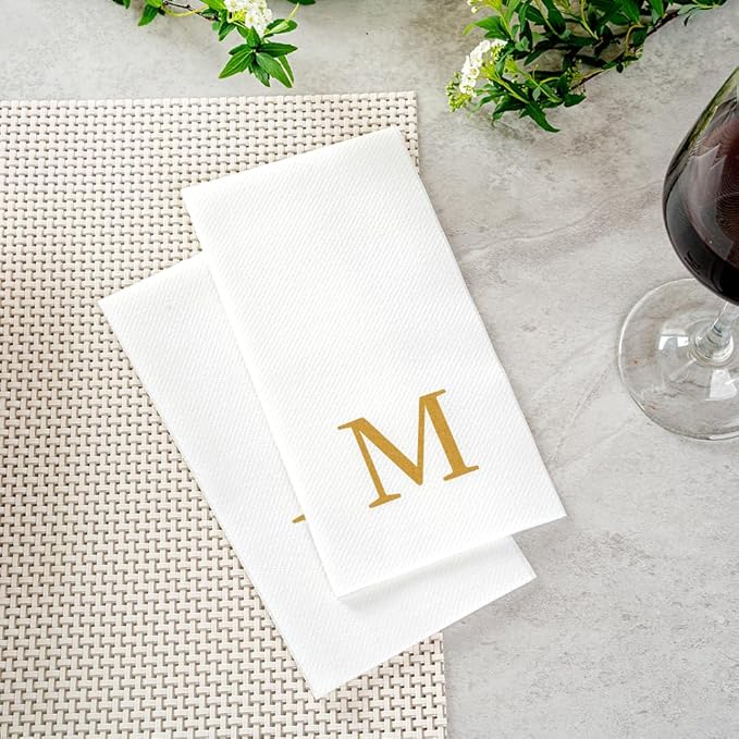 Restaurantware Napkins Pack of 300 Gold Letter M Linen-Feel Paper Disposable Guest Towels 15.75 x 7.87 Inches, Elegant Airlaid White Napkins For Birthdays, Weddings and Catering Events